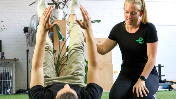 This is an Exercise Physiology consultation focusing on trunk control for lower back pain